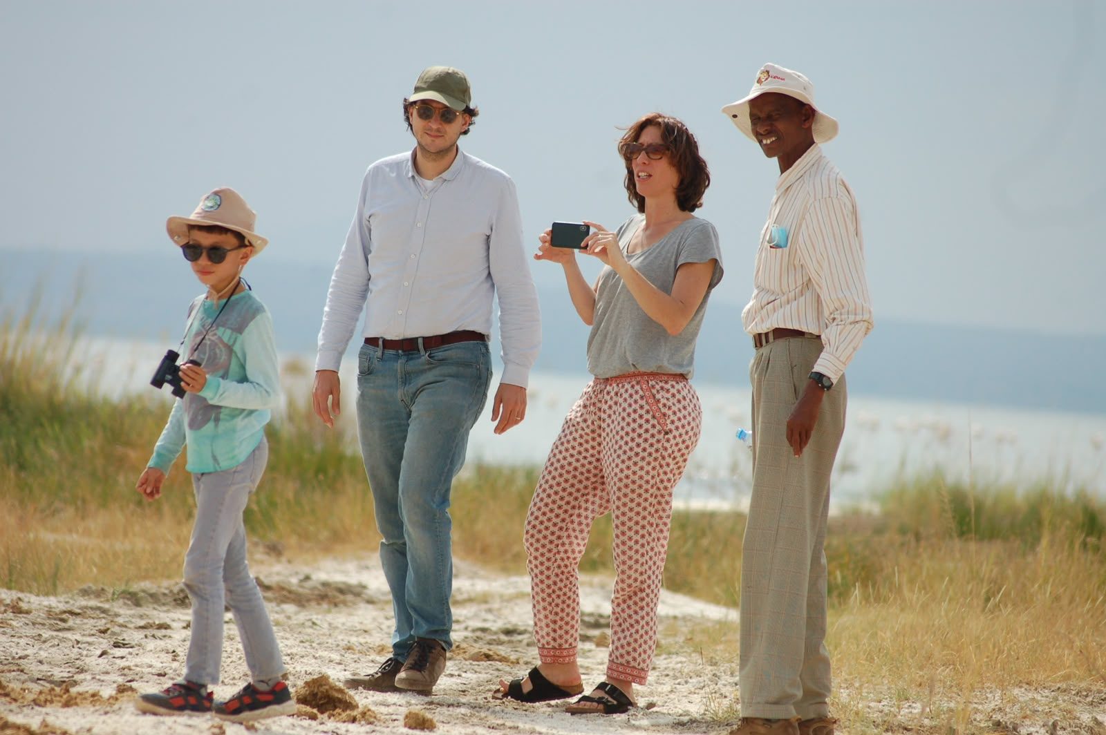 Family safari walk along a Rift Valley lakeshore